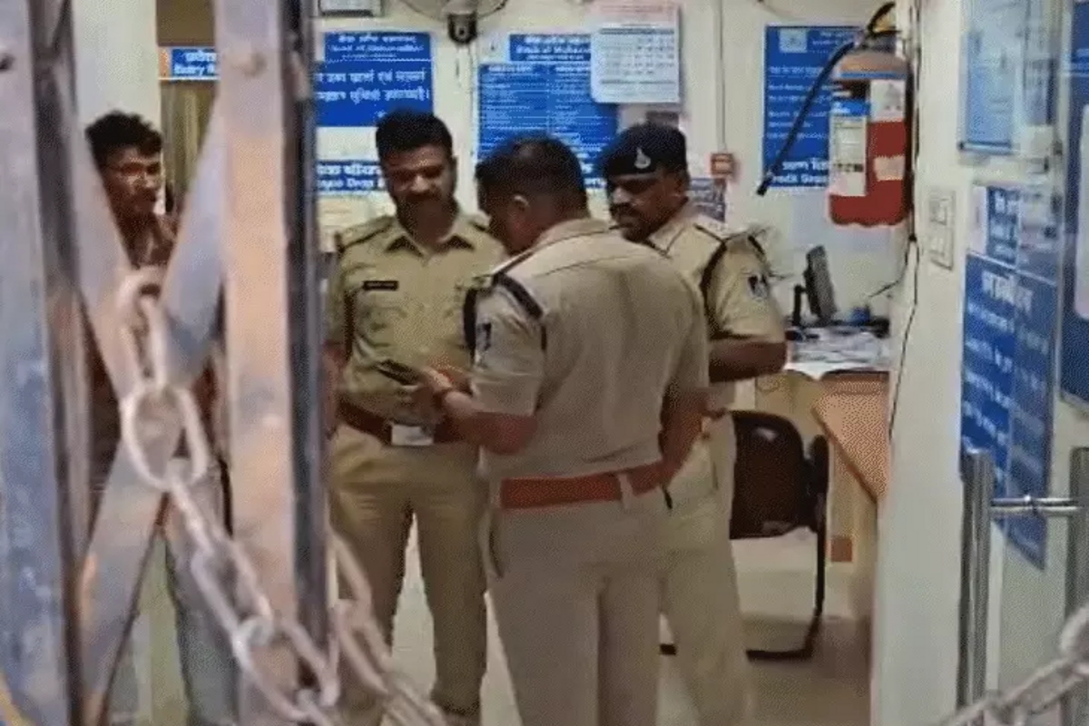 Police personnel inspecting the crime scene